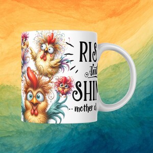 May include: White ceramic mug featuring a colourful illustration of chickens and the text "Rise and Shine...mother clucker".