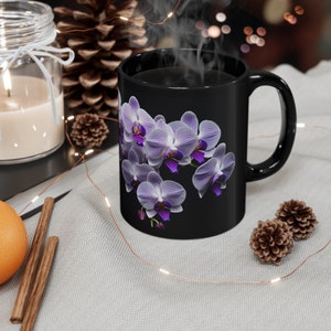 Delicate purple and white orchids  This exquisite floral design adds a touch of sophistication to your morning coffee routine.
