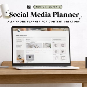 May include: A laptop displaying a "Social Media Planner" Notion template, with the text "ALL-IN-ONE PLANNER FOR CONTENT CREATORS." The laptop sits on a wooden desk, next to a gray mug and a white desk lamp.