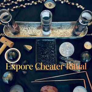 May include: An assortment of ritual items arranged on a black surface. Includes glass jars, candles, crystals, a wooden mallet, and the text "Expore Cheater Ritual". The items are arranged on a metal tray and scattered around the surface.