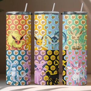 May include: Three stainless steel tumblers with colorful designs featuring Pokemon characters. Each tumbler has a different set of Pokemon characters, including Eevee, Vaporeon, Jolteon, Flareon, Espeon, Umbreon, Leafeon, and Glaceon. The tumblers are perfect for holding hot or cold beverages.