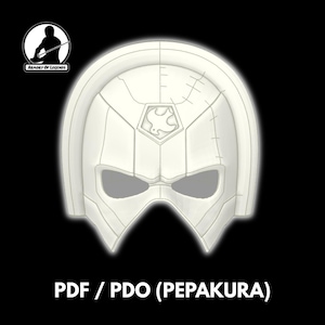 Puede incluir: Una máscara blanca estilizada con aberturas para los ojos y un emblema central. La máscara tiene una parte superior redondeada y una barbilla puntiaguda. El texto "PDF / PDO (PEPAKURA)" está en la parte inferior. El logotipo de Armory of Legends está en la esquina superior izquierda.
