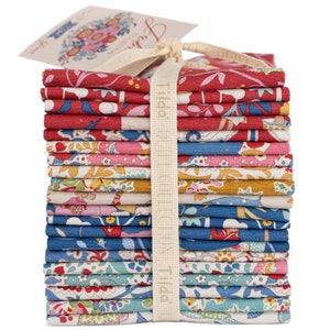 May include: A stack of 18 fabric squares with various floral patterns in shades of red, blue, pink, and yellow. The fabric squares are tied together with a white ribbon and labeled "Tilda Fabrics".