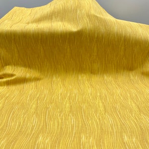 Joann Yellow wavy lines glitter cotton quilt fabric by the yard