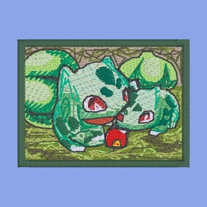 May include: A green and red embroidered patch featuring two cartoon characters from the Pokemon franchise. The characters are Bulbasaur and Ivysaur, both with red eyes and a green body. The patch is surrounded by a brown frame.