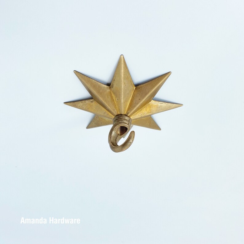 Brass Star Hook For Hanging Planters, Wind Chimes, Swag Pendent Lights and Keys - Decorative Open Hook For Home Ceiling & Wall Decor - Image showing star hook mounted on ceiling - AmandaHardware.etsy.com