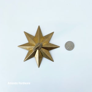 Brass Star Hook For Hanging Planters, Wind Chimes, Swag Pendent Lights and Keys - Decorative Open Hook For Home Ceiling & Wall Decor - Image showing star hook next to quarter for size comparison - AmandaHardware.etsy.com