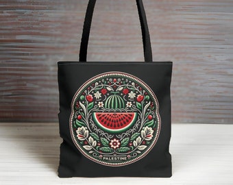 May include: Black tote bag with a circular design featuring a watermelon slice, green leaves, and red and white flowers. The design is surrounded by a green circle with the word "PALESTINE" in white lettering.