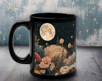 May include: Black ceramic mug featuring a full moon and starry night scene. The design includes a large full moon, stars, and a field of flowers and mushrooms.