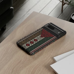 May include: A black phone case with a colorful geometric pattern. The pattern features red, yellow, green, and blue colors.