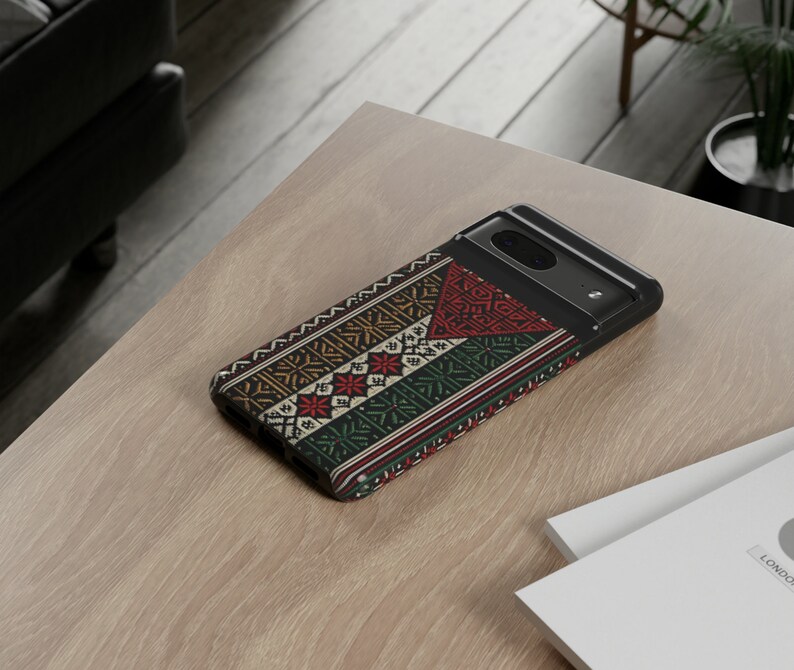 May include: A black phone case with a colorful geometric pattern. The pattern features red, yellow, green, and blue colors.