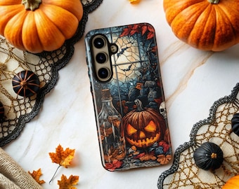 May include: A phone case with a Halloween-themed design featuring a jack-o'-lantern, bats, and a spooky window scene. The case is surrounded by orange pumpkins, black decorative elements, and fall leaves, creating a festive autumn aesthetic.