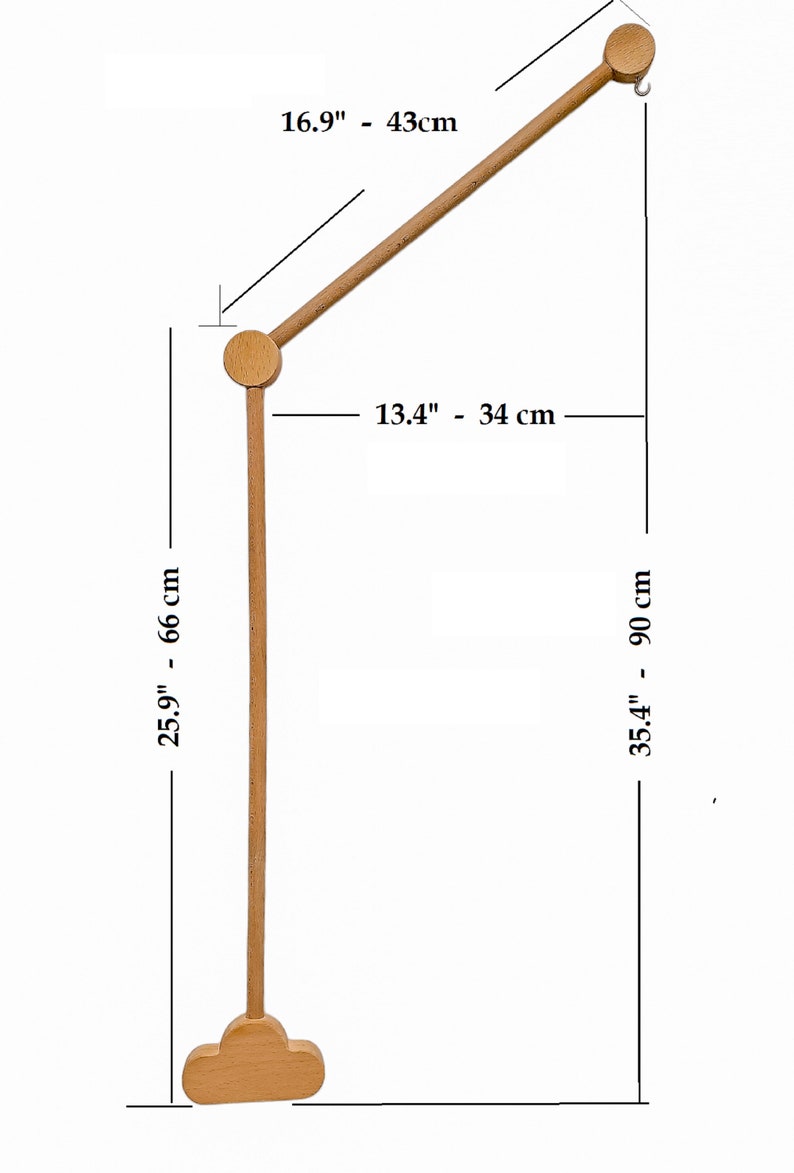May include: Wooden baby mobile stand with a cloud-shaped base. The stand is 25.9 inches tall and 13.4 inches wide. The arm is 16.9 inches long.
