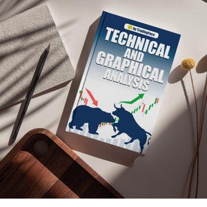 Puede incluir: Un libro titulado "Technical and Graphical Analysis" de TradingFace. La portada presenta un oso y un toro azules con gráficos de mercado verde y rojo. Un lápiz y un bloc de notas son visibles.