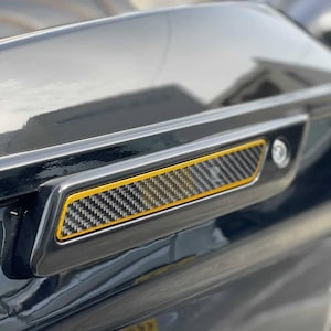 Carbon Fiber latch inserts for Harley with logo