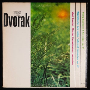 May include: A vintage vinyl record album cover featuring a green and yellow nature scene with the text "Dvorak" in large, bold letters. The album title is "String Quartet in E flat major, op. 51" and "Bagatelles for two violins, 'cello and harmonium, op. 47". The album is by the Vlach Quartet and features Miroslav Kampelsheimer on harmonium. The album number is ALP-706.
