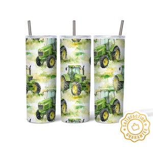 May include: Three stainless steel tumblers featuring a green tractor pattern. The tumblers have a white background with green, yellow, and brown watercolour accents. The tractors are green and black with brown wheels. The tumblers come with a straw.