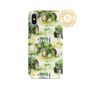 May include: A phone case featuring a watercolour design of green tractors on a white background. The case has a gold sticker with the words "Satisfaction Guarantee" and a thumbs up icon.