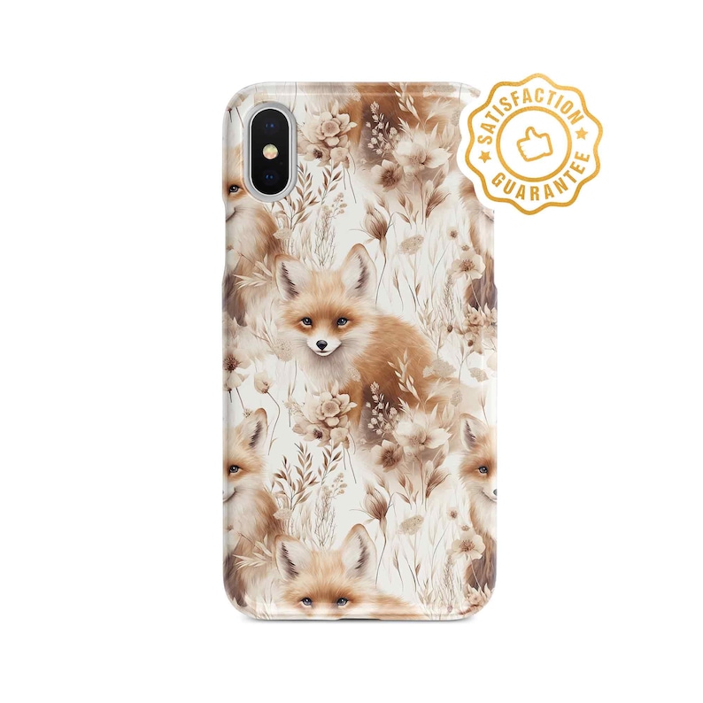 May include: A white phone case with a pattern of brown foxes and flowers. The case has a cut-out for the camera lens and a gold sticker that says "Satisfaction Guarantee".