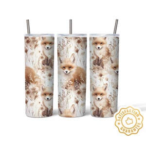 May include: Three stainless steel tumblers with a white background and a repeating pattern of brown foxes and flowers. The tumblers have lids and straws.