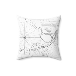 May include: A black and white vintage map of the Promontory of East Florida, showing the coastline and surrounding waters. The map is surrounded by a compass rose and includes text describing the map's creation and purpose.