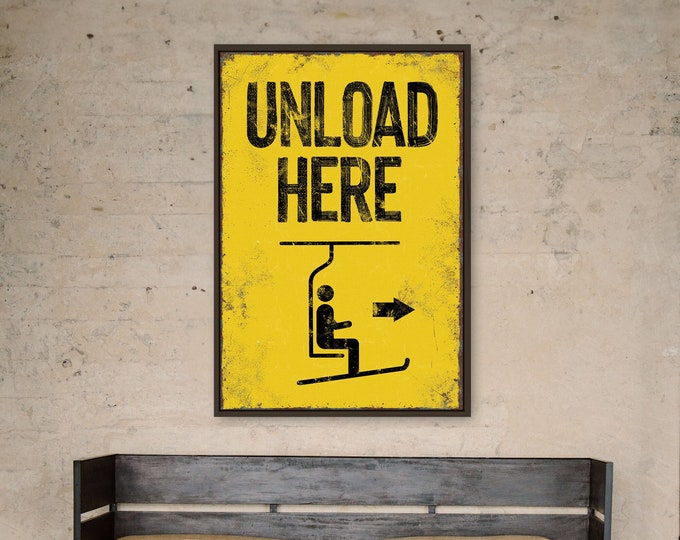 extra large "unload here" ski lift sign > vintage yellow with faux rusty edges, antique skiing wall art for retro mountain lodge decor,