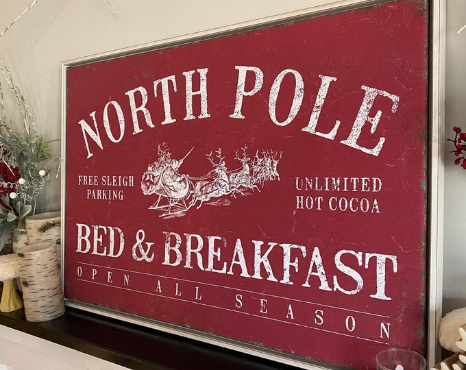 North Pole Bed and Breakfast Sign with a Rustic Santa Sleigh in Cream on Barn Red