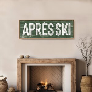 a fireplace with a sign above it that says apres ski