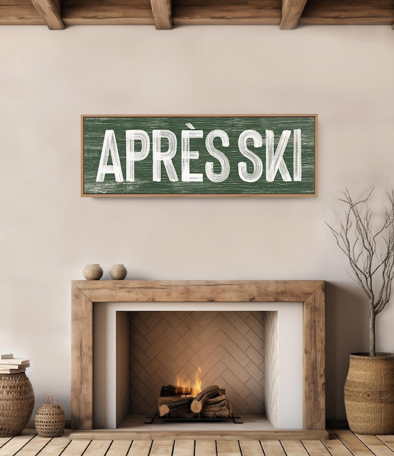 a fireplace with a sign above it that says apres ski