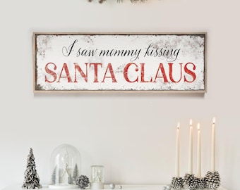 Decoración navideña para pared, cartel con la letra "I Saw Mommy Kissing Santa Claus" en color rojo granero y crema.