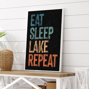 Eat Sleep Lake Repeat sign on black, retro lake house canvas prints, vacation rental art, fun lake house signs, vintage lake wall art decor
