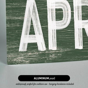 a wooden sign with the word apr written on it