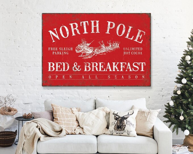 Reindeer Canvas Art, North Pole Bed and Breakfast Sign with a Cream Sleigh on Barn Red