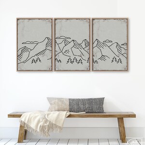 a wooden bench sitting in front of a white wall
