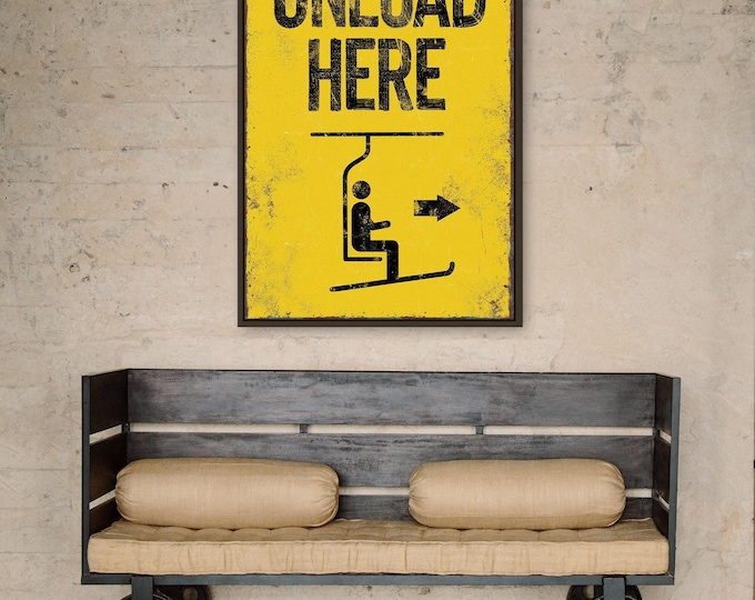 extra large "unload here" ski lift sign > vintage yellow with faux rusty edges, antique skiing wall art for retro mountain lodge decor,
