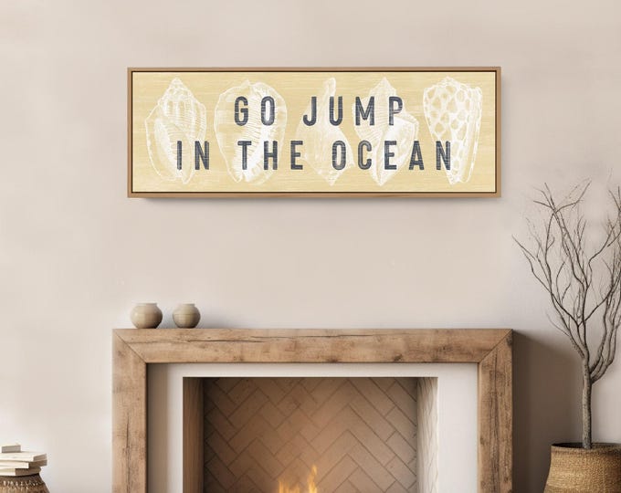 Cream and pale yellow seashell art, go jump in the ocean lettering, large framed canvas for a vacation home