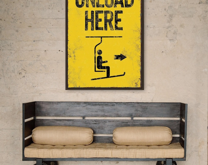 extra large "unload here" ski lift sign > vintage yellow with faux rusty edges, antique skiing wall art for retro mountain lodge decor,