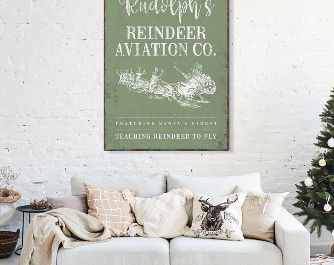 Reindeer Flying Art, Rudolph's Aviation Co Featuring Santa's Finest in Cream on Sage Green