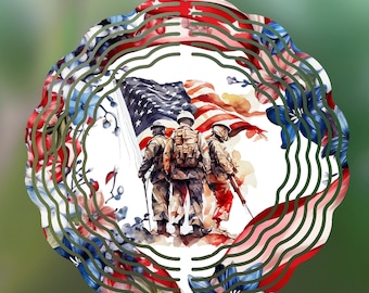 May include: A metal wind spinner with a circular design featuring an American flag and three soldiers standing in front of it. The soldiers are wearing camouflage uniforms and holding rifles. The wind spinner is decorated with red, white, and blue flowers.