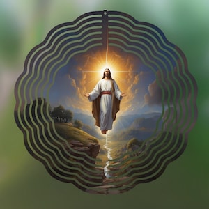 May include: A metal wind spinner with a circular design featuring a depiction of Jesus Christ ascending into heaven with a bright light behind him. The background is a landscape with mountains and clouds.