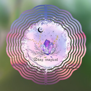 May include: A pink and purple metal wind spinner with a crescent moon, stars, and crystals. The wind spinner has the text "Stay magical" on it.