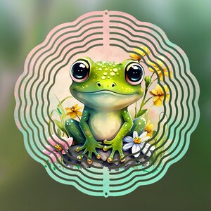 May include: A whimsical, green frog with large, expressive eyes sits among yellow and white flowers. The frog is inside a decorative, circular frame with a wavy, layered design. The background has a gradient of pink and green.