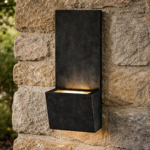 May include: A set of three ceramic mugs with a speckled, matte finish in cream, light grey, and dark grey. Each mug has a simple, minimalist design, ideal for coffee or tea.