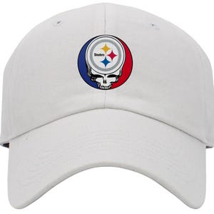 May include: White baseball cap with a black, yellow, blue, and red Pittsburgh Steelers logo with the word "Steelers" on it.