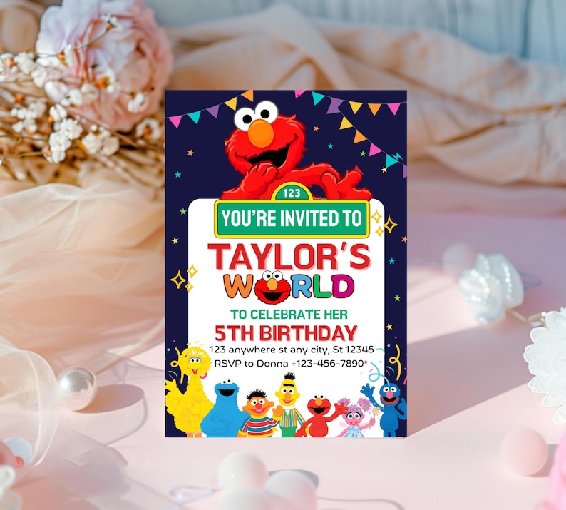 May include: A colorful birthday invitation featuring Elmo from Sesame Street. The invitation has the text "You're Invited to Taylor's World" and "5th Birthday". The invitation includes the address and RSVP information.