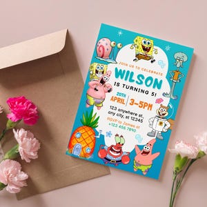 May include: A teal birthday invitation featuring cartoon characters from a popular animated series. The invitation reads "Join us to celebrate Wilson is turning 5!" with event details. A brown envelope and pink flowers are in the background.