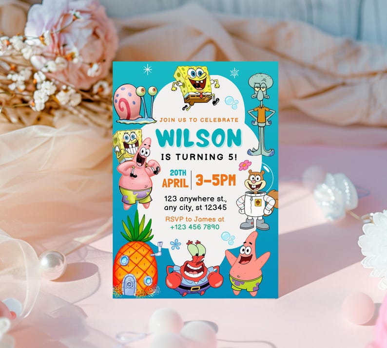 May include: A vibrant invitation card with cartoon characters. The card has a turquoise background with the text "WILSON IS TURNING 5!" and event details. Various cartoon characters are displayed around the invitation, perfect for a child's birthday party.