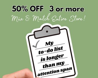 May include: A white checklist with a black checkmark and the text "My to-do list is longer than my attention span" on a clipboard with a gray top. The checklist is being held by a hand.