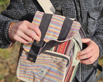 May include: A multi-colored striped hemp backpack with a black zippered pocket and a small patch that says "Himalayan Hemp".