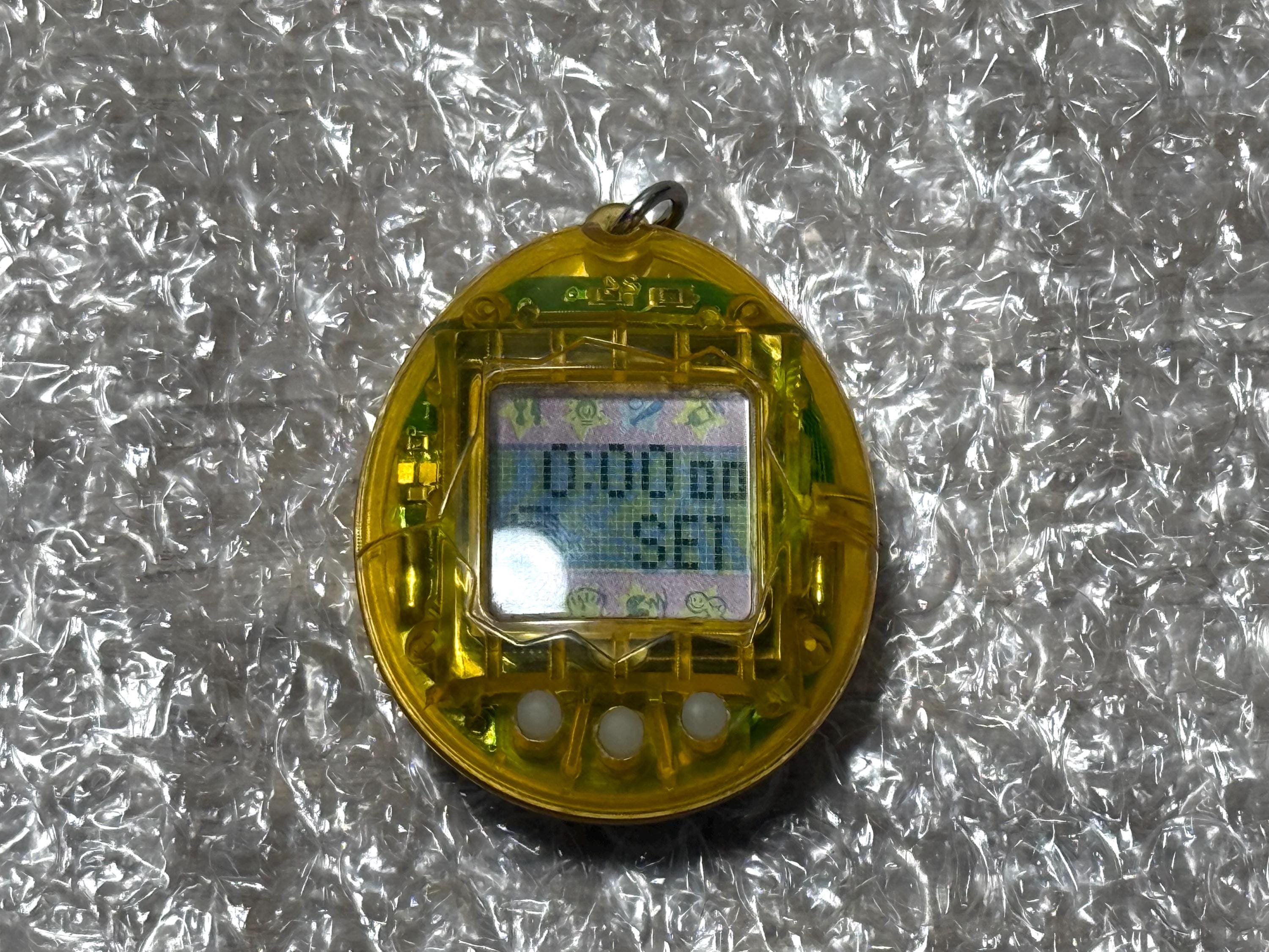 レアカラーたまごっち 初代スケルトン クリアイエロー バンダイ 日本語